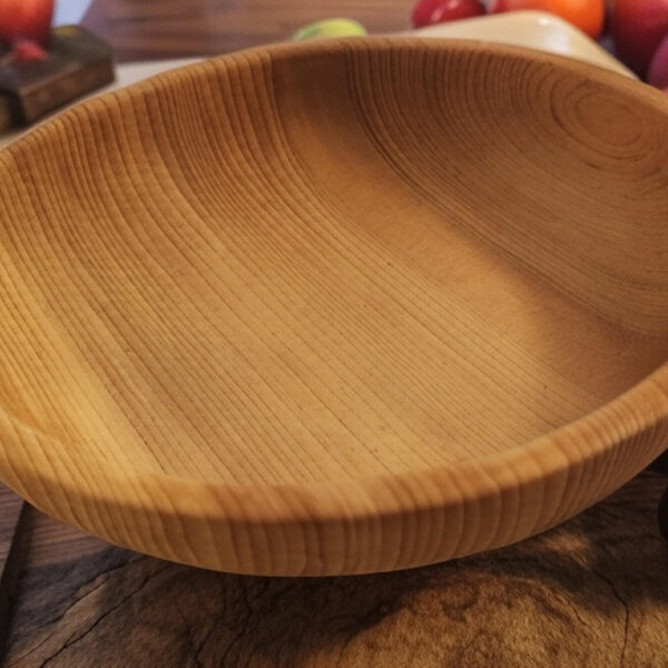 Handcrafted wooden bowl made from Siberian fir wood for kitchen decor and serving